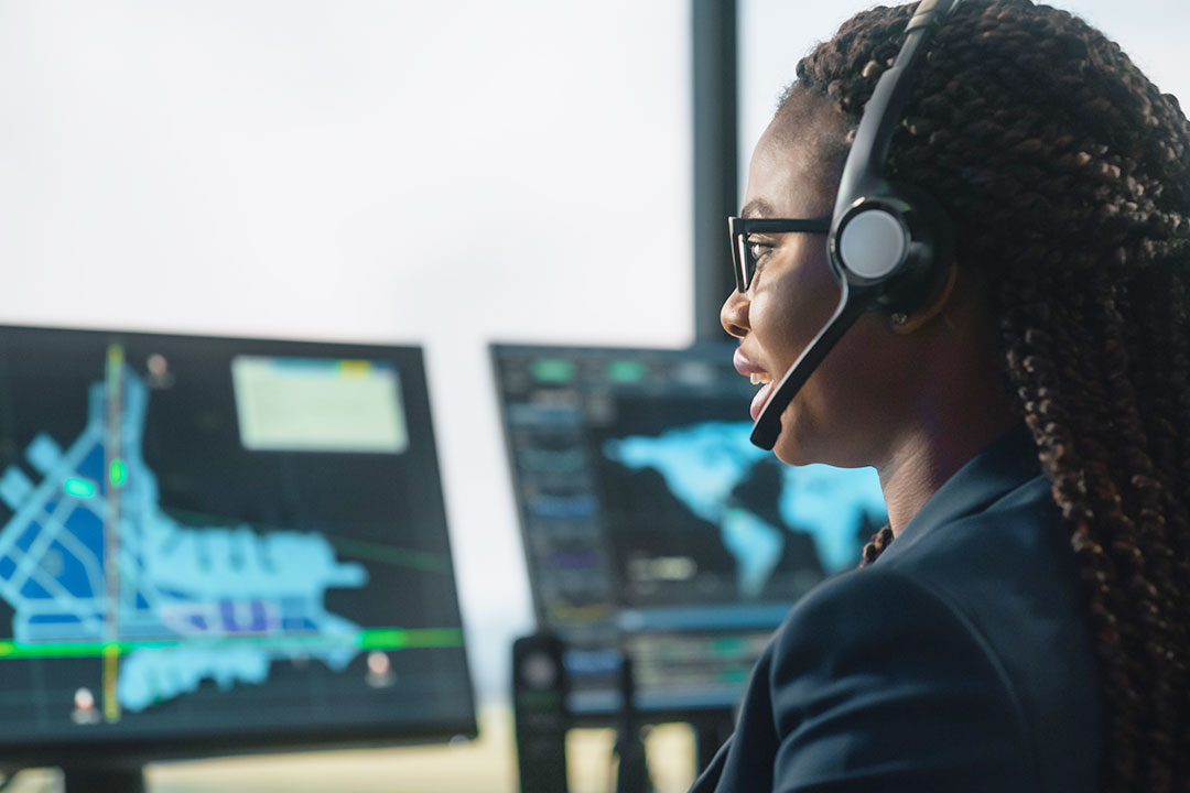 Flight operations officer monitoring traffic on a radar screen