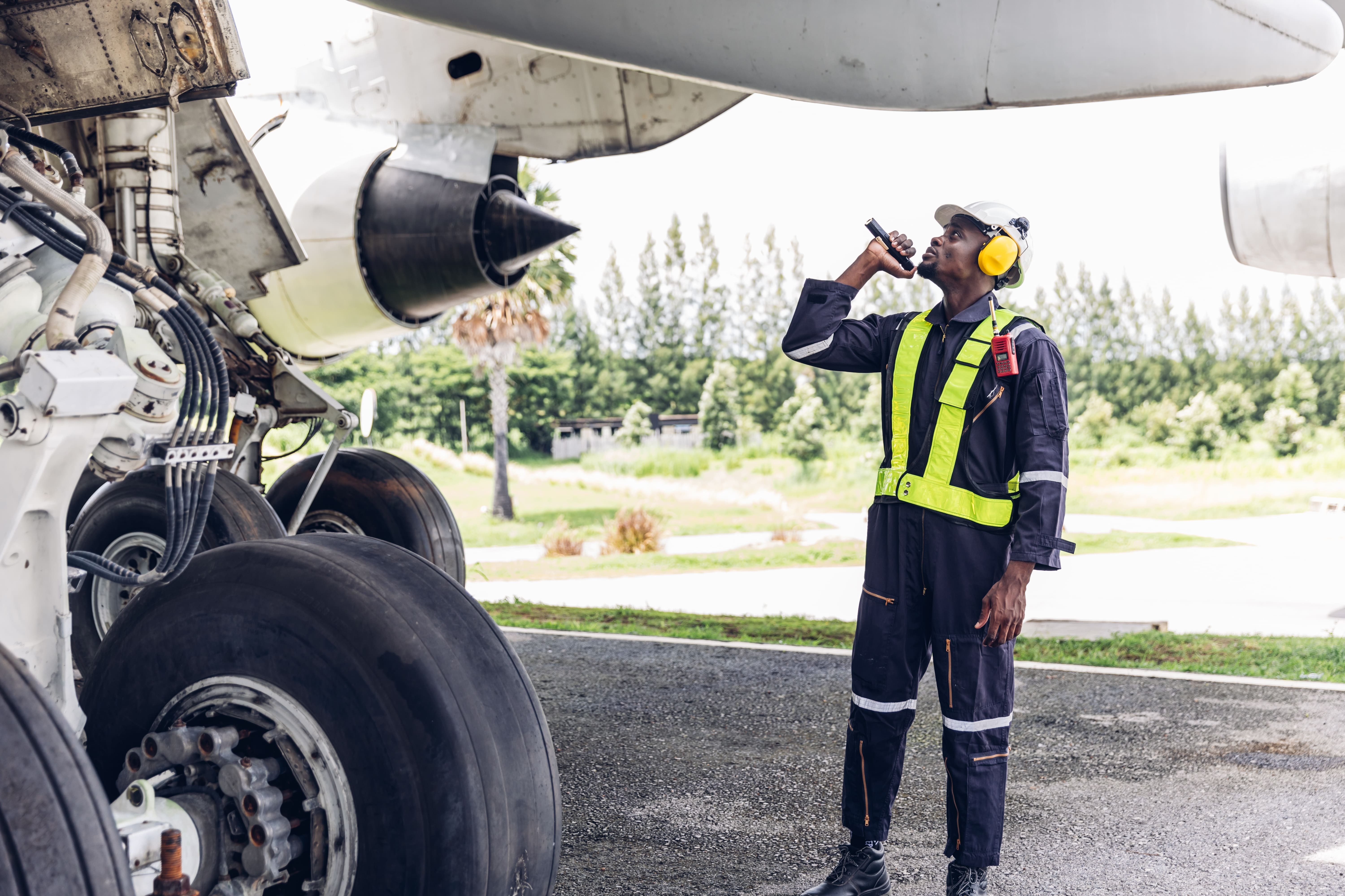 Ground crew servicing an aircraft on the ramp